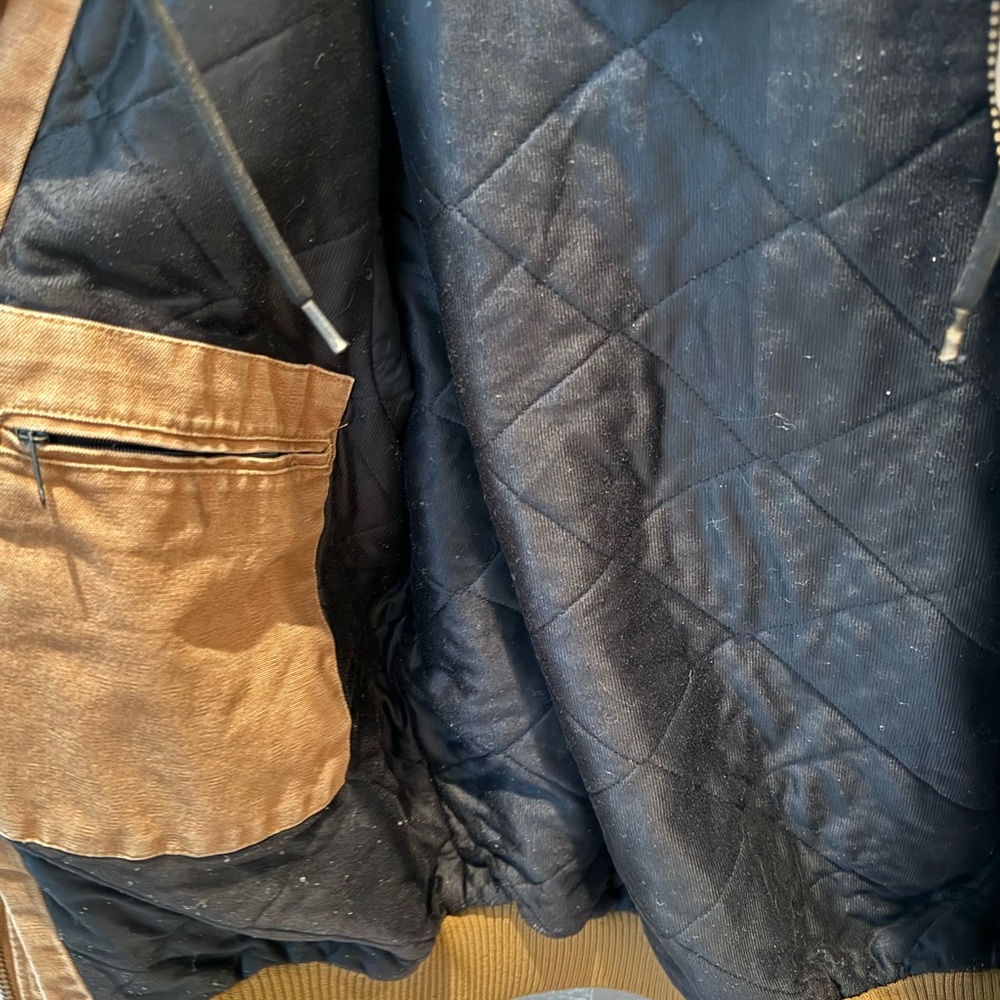 Carhartt brown loose fit warm jacket with hood. Very broken in/ pre-loved.